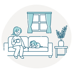 リビングのソファーに座って犬と一緒にくつろぐ女性