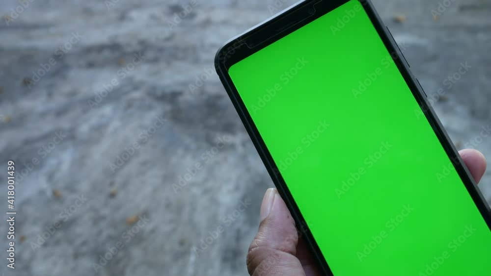 Aufkleber point of view of man using phone with green mock-up screen chroma key watching content shifting scre