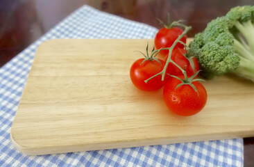 Red cherry tomatoes on the cutting board               