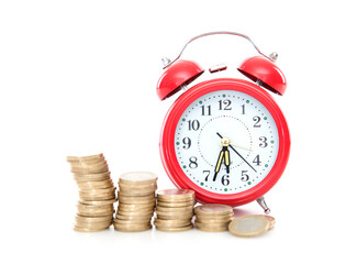 An alarm clock and a row of euro coins on a white background