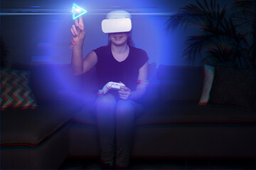 Fototapeta premium Woman playing game at home using vr headset