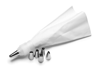 Pastry bag and different tips on white background