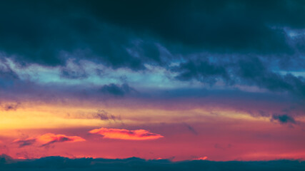 Sunrise Sky. Bright Dramatic Sky With Colorful Clouds. Yellow, Orange And Magenta Colours