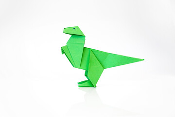 green origami paper dinosaur