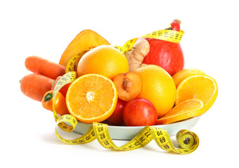 Plate with healthy products and measuring tape on white background