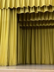 Several layers of green curtain on stage