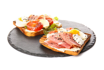 Slate plate with fresh tasty bruschettas on white background
