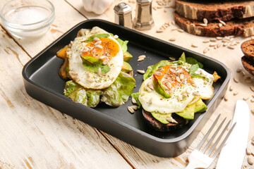 Tray with fresh tasty bruschettas on wooden background