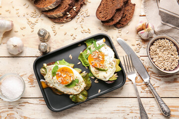 Tray with fresh tasty bruschettas on wooden background