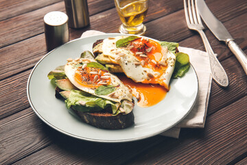 Plate with fresh tasty bruschettas on wooden table