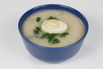 fresh vegetable soup with egg and sour cream. Isolated on a white background