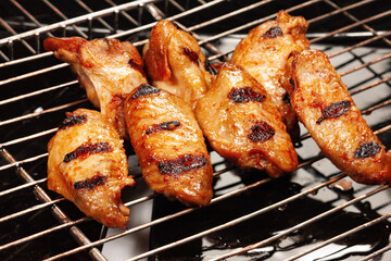 Chicken wings cooked on the grill with the grill