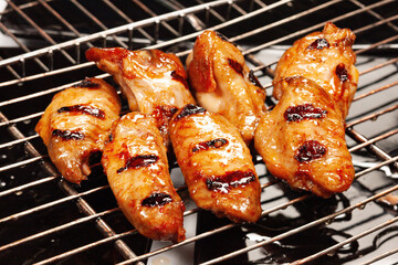 Chicken wings cooked on the grill with the grill