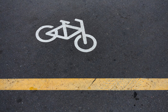Image of Bicycle sign or icon on the road in the park. Bike path