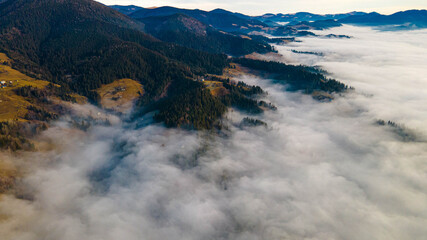 mountains tops high above clouds fog