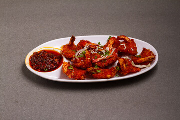 deep fried shrimp meat ball with sweet sauce on gray background