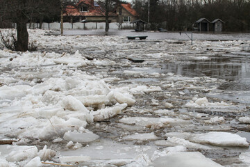 Large fragments of ice on the river bank