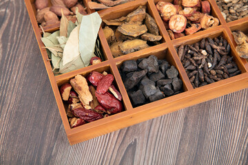 All kinds of Chinese herbal medicine in wooden lattice box