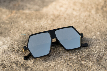Futuristic oversized sunglasses model with silver color lenses shoot outdoor closeup . Selective focus. High quality photo