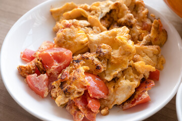 close up of omelet fried with tomato