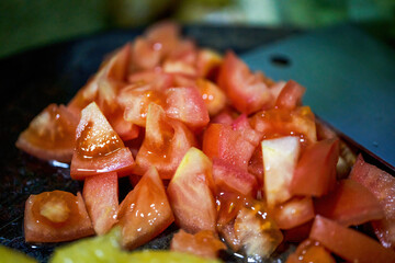 Close-up of cut tomato on cutting board