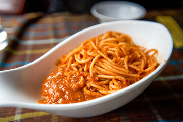 A tempting spaghetti with meat sauce, fork the pasta