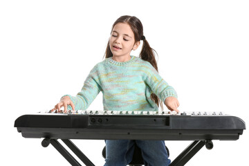 Little girl playing synthesizer on white background © Pixel-Shot