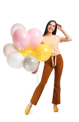 Fototapeta premium Beautiful young woman with balloons on white background