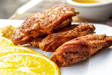 A close-up of a golden tempting deep-fried chicken wings