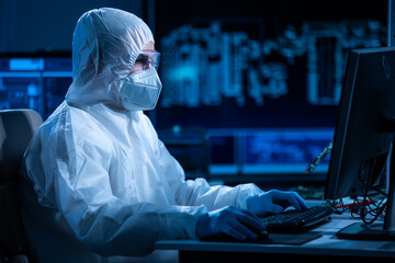 Microelectronics engineer works in a modern scientific laboratory on computing systems and...