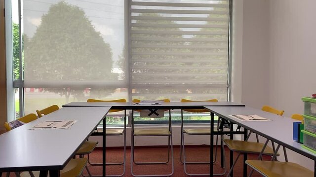 classroom with big window empty due to covid-19 outbreak - wide 