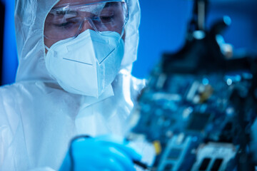 Microelectronics engineer works in a modern scientific laboratory on computing systems and...