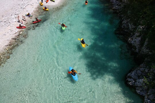 Fantastic rafting and kayaking place. Active kayaker with colorful life jacket, paddling and exercises on the emerald colored Soca river, Bovec, Triglav National Park, Slovenia, Europe © designbetrieb.de