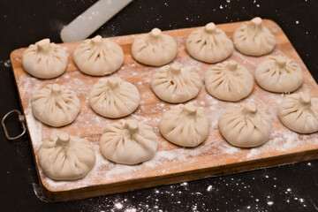 Symmetrical rows of uncooked Georgian khinkali