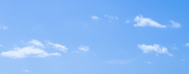 Naklejka na ściany i meble Background of blue sky with clouds