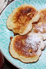 Traditional apple fritters on the plate.