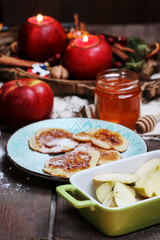 Fototapeta na wymiar Traditional apple fritters on the plate.