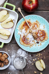 Traditional apple fritters on the plate.