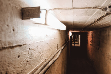 Dark corridor of old abandoned Soviet underground bunker. Defocused