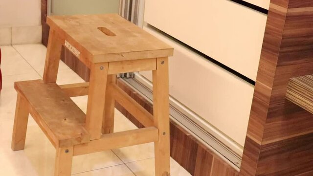 wooden stool under tall closet - medium 