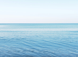 Obraz premium Blue ocean and blue sky background