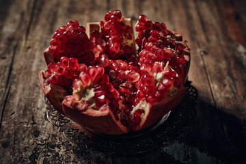 Ripe pomegranate on wooden table