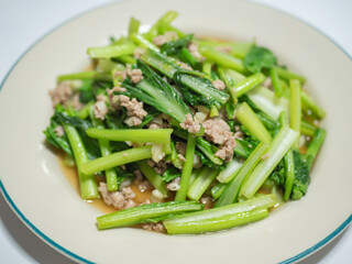 Stir fry Chinese mustard green (bog choy) with minced pork