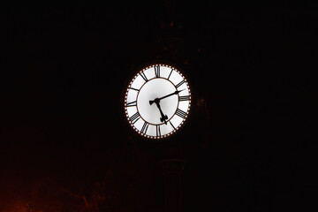 Vintage street clock at night