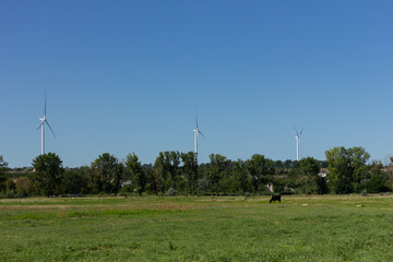 Wind turbines on a background of sky and nature