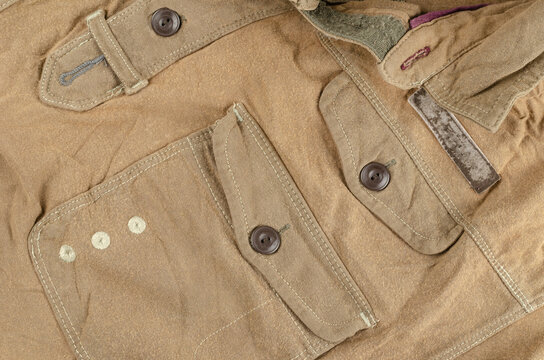 A crumpled brown shirt with a pocket and buttons.