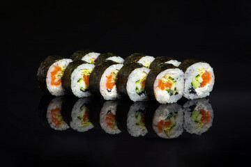 futomaki rolls with salmon on blacj © Chumak Photo