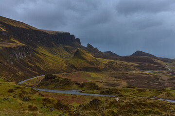 famous scenery of The Quiraing on the Isle of Skye with a sheep in a cloudy day , Scotland. big hills and mountains