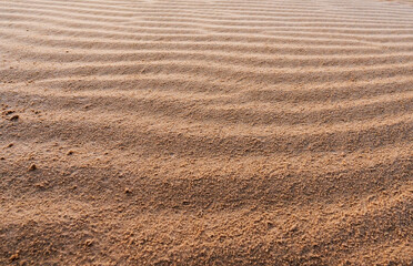 sand texture on a desert dune with patterns in the form of waves created by the wind