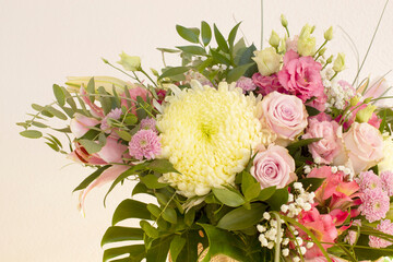 Beautiful floral background. Bouquet of salmon colored roses, archideas and other flowers. Mom's day, wedding invitation, birthday. Copy space